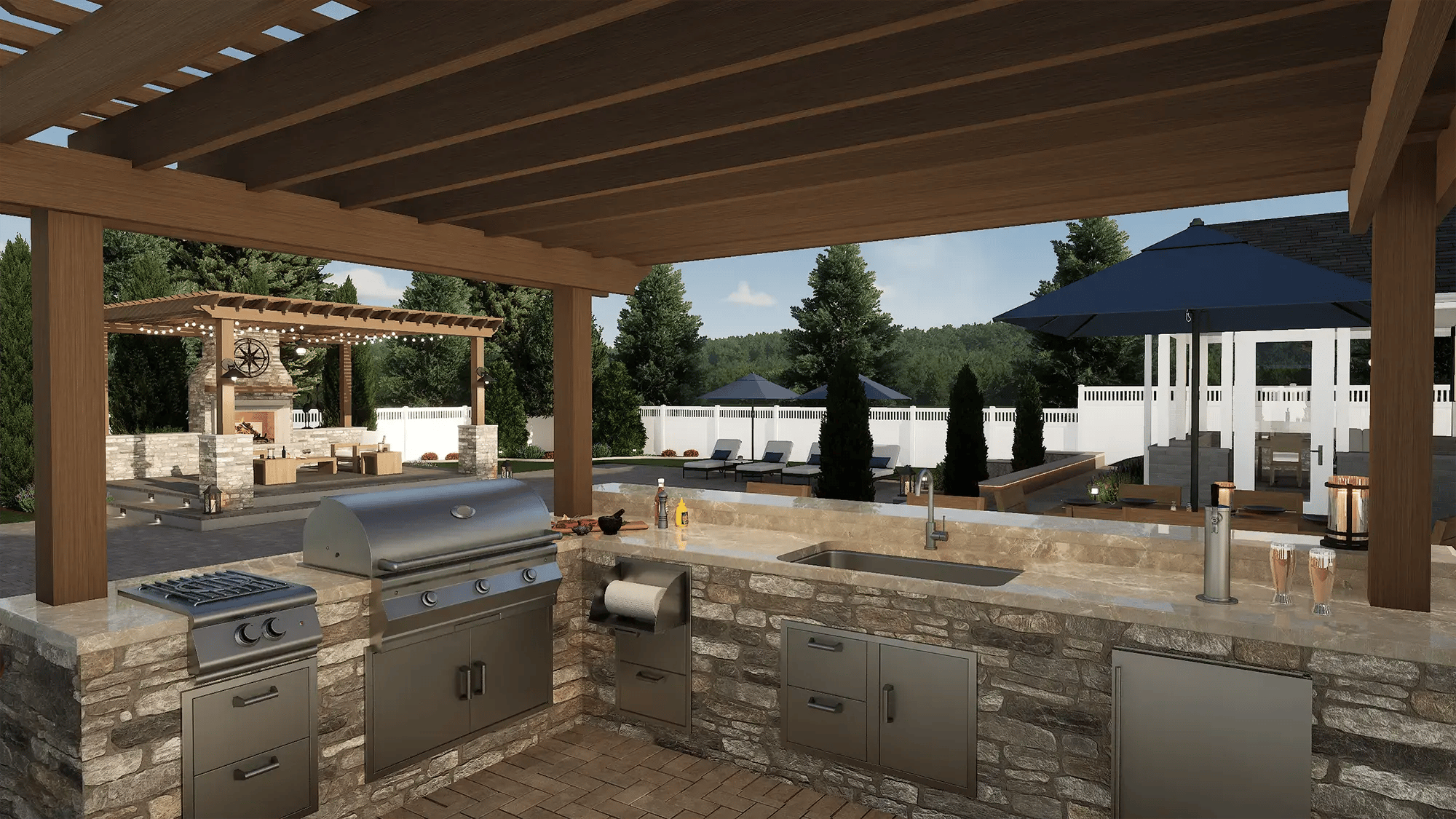 Stone countertop kitchen setup with grill, sink, and prep workspace