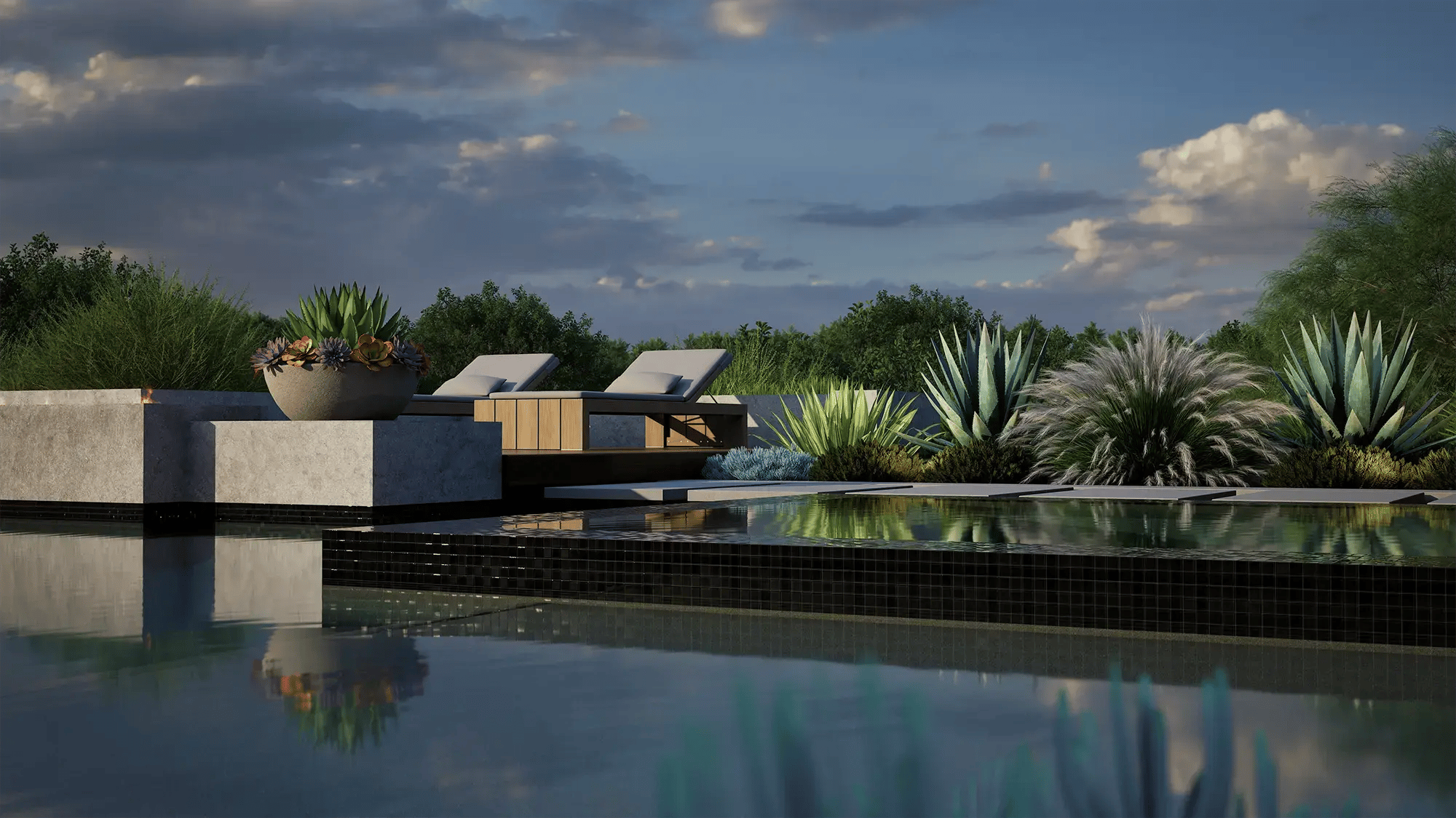 Close-up of pool water feature pouring into reflective surface at sunset with soft landscape backdrop