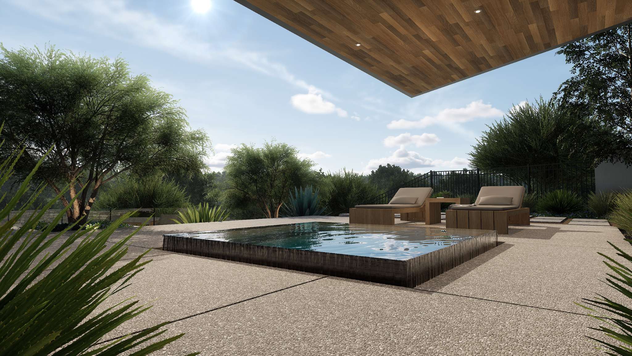 Modern outdoor patio with a raised pool, lounge chairs, and desert landscaping.