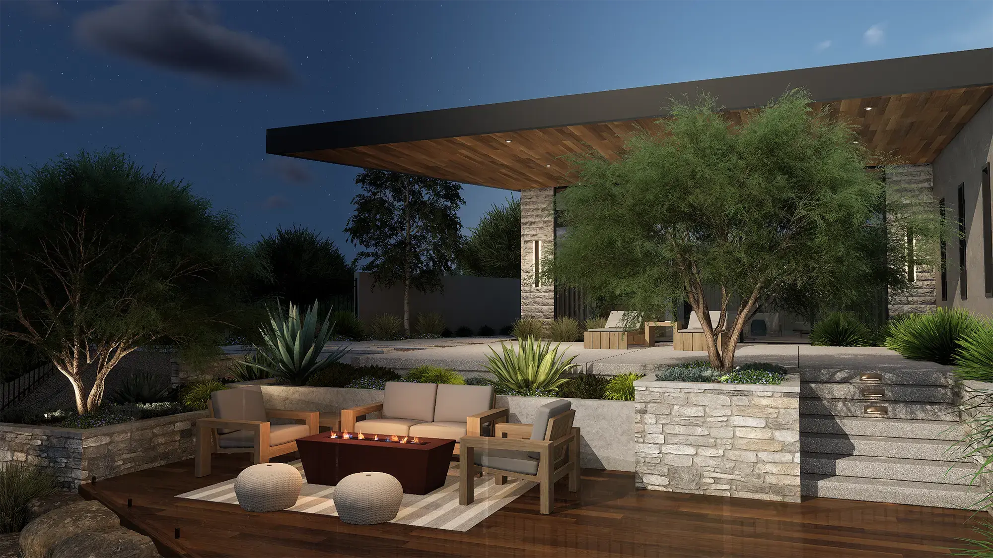 Desert deck and stone retaining wall at night, designed in VizTerra.